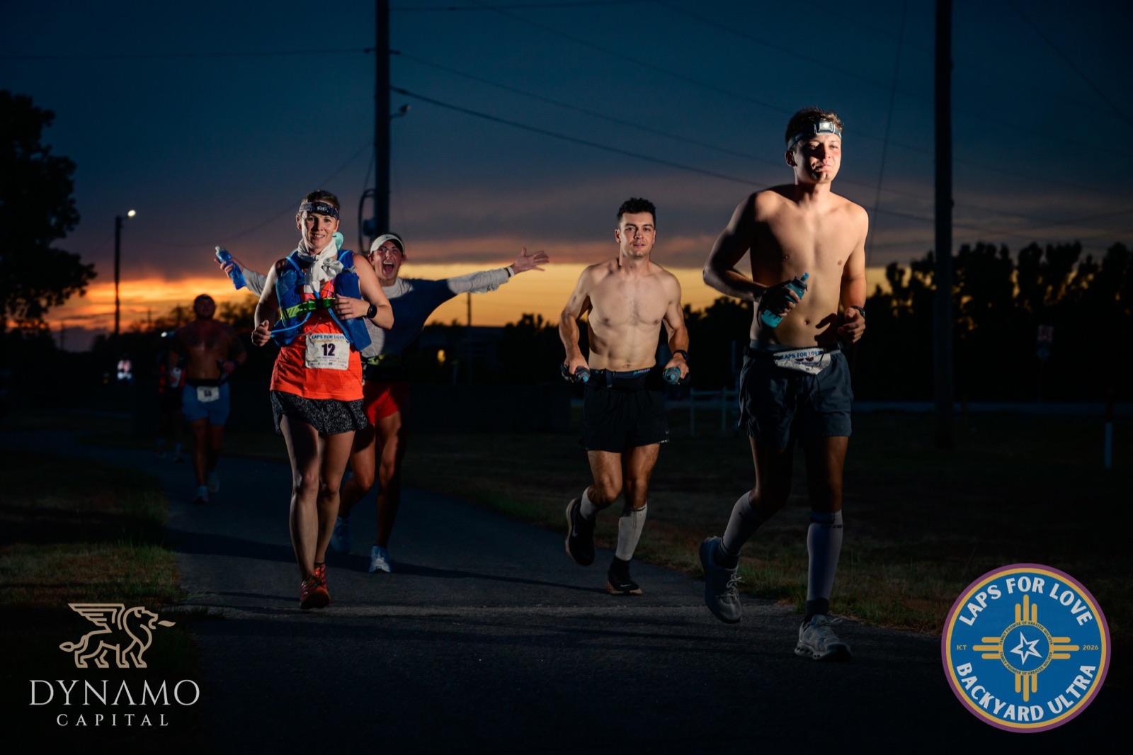 Runners on the course at sunset